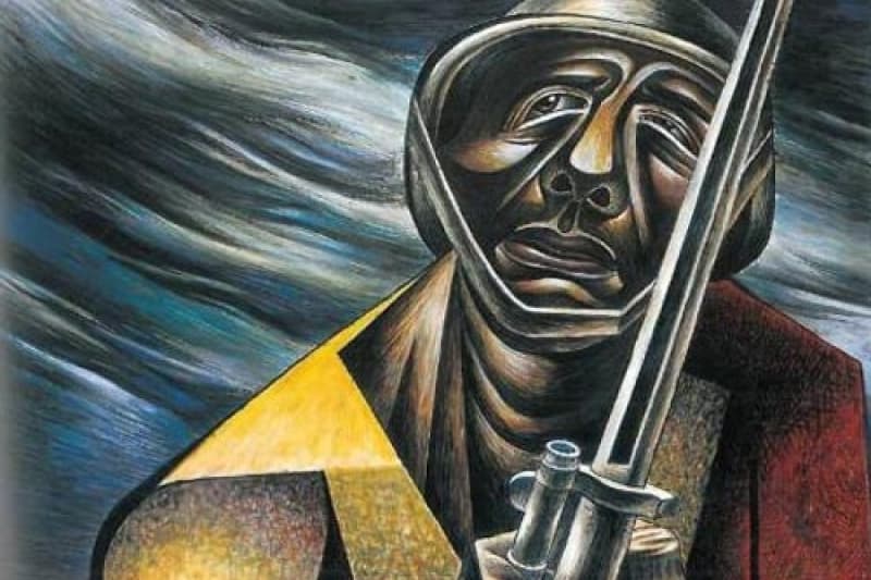 A soldier painted in gold and red.