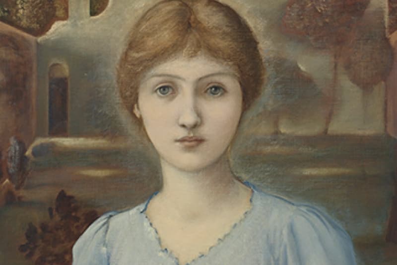 Woman in a blue dress, holding a book in her hand