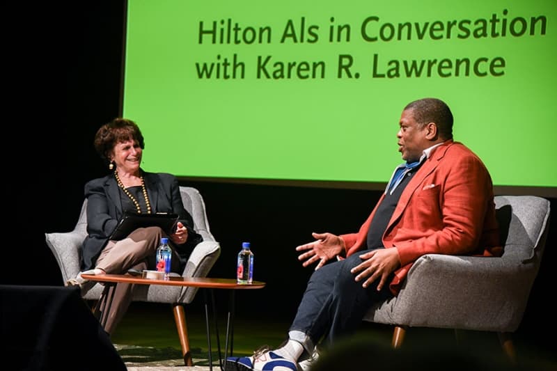 Two people in conversation on a stage.