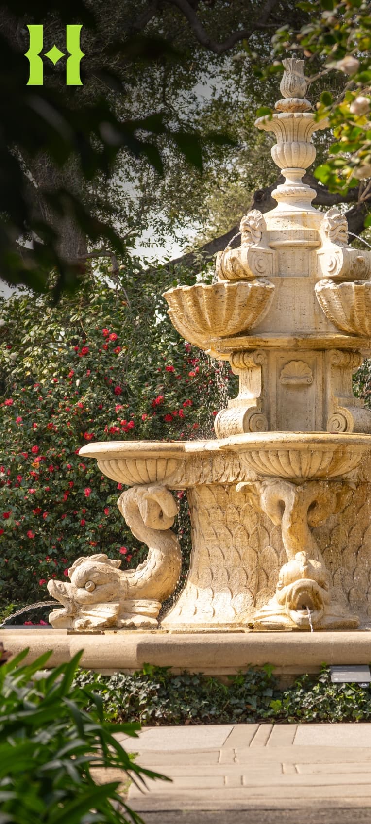 A large tiered fountain in a garden.