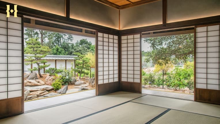 A view of a garden from within a Japanese-style home.