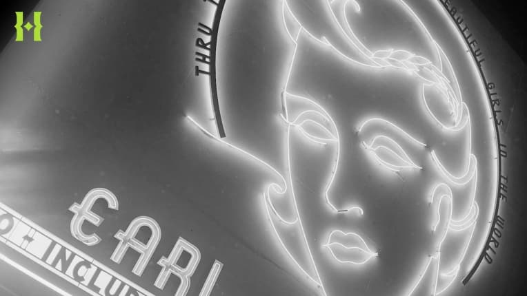 A black and white photo of a theatre sign.